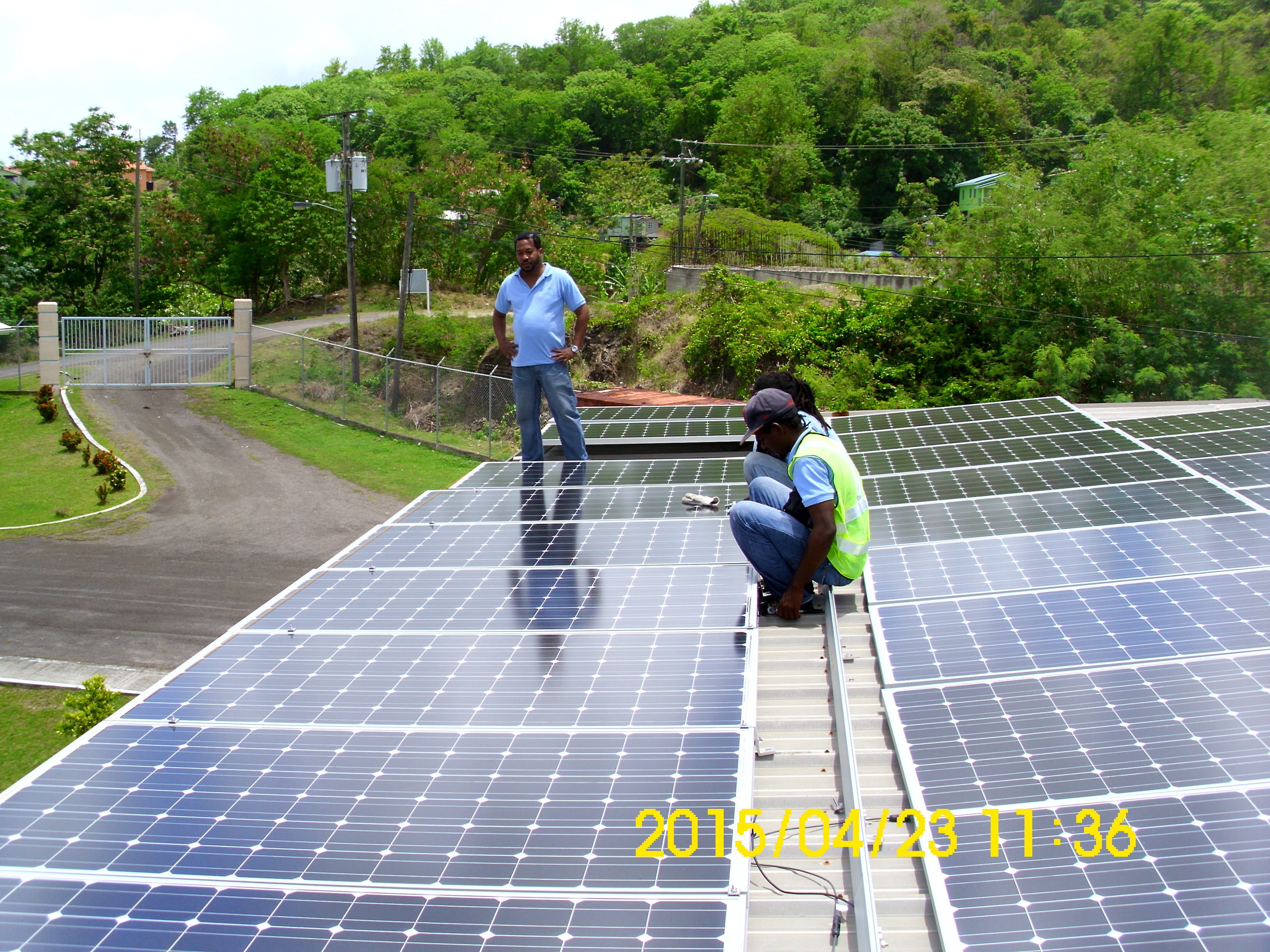 Grid-tie solar PV system installation with multiple solar panels generating renewable electricity